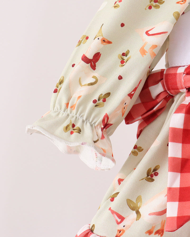 Cream long-sleeve ruffle top with red animal print and gathered elastic cuffs