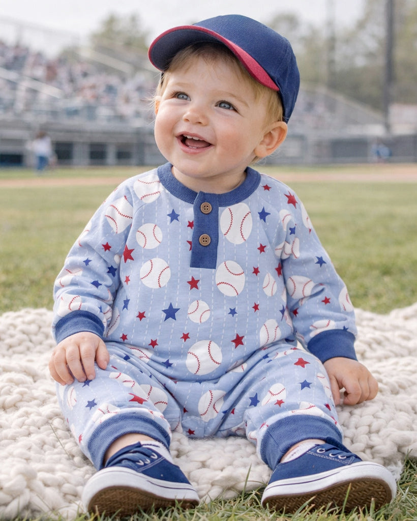 Long-sleeve henley romper in light blue with baseball and star print, button front