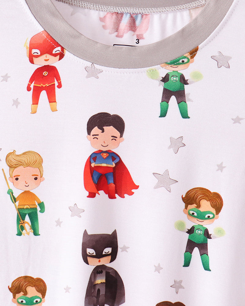 Character print pajama top close-up with grey collar and superhero motifs