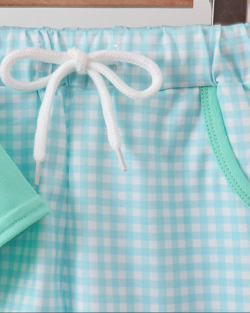 Blue and mint gingham shorts with white drawstring and elastic waist