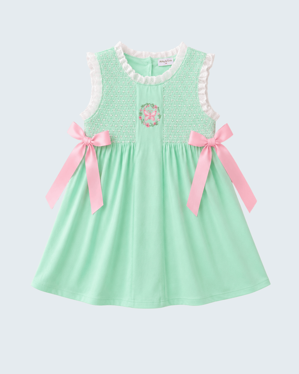 Green Butterfly Smocked Dress on light grey backgrund