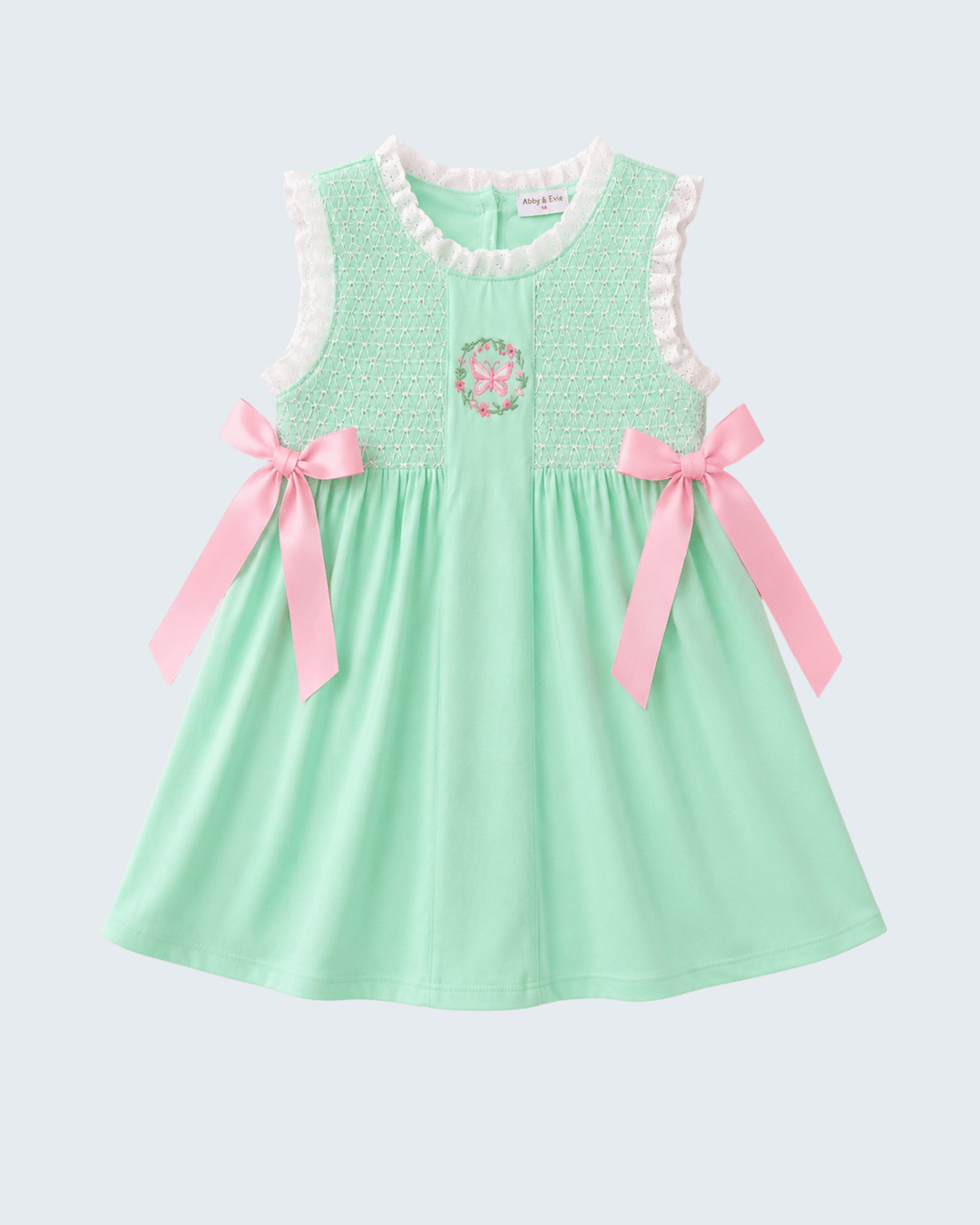 Green Butterfly Smocked Dress on light grey backgrund