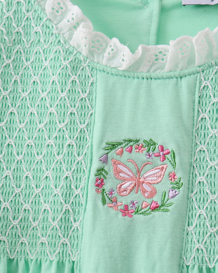 Mint green dress with butterfly and floral embroidery detail