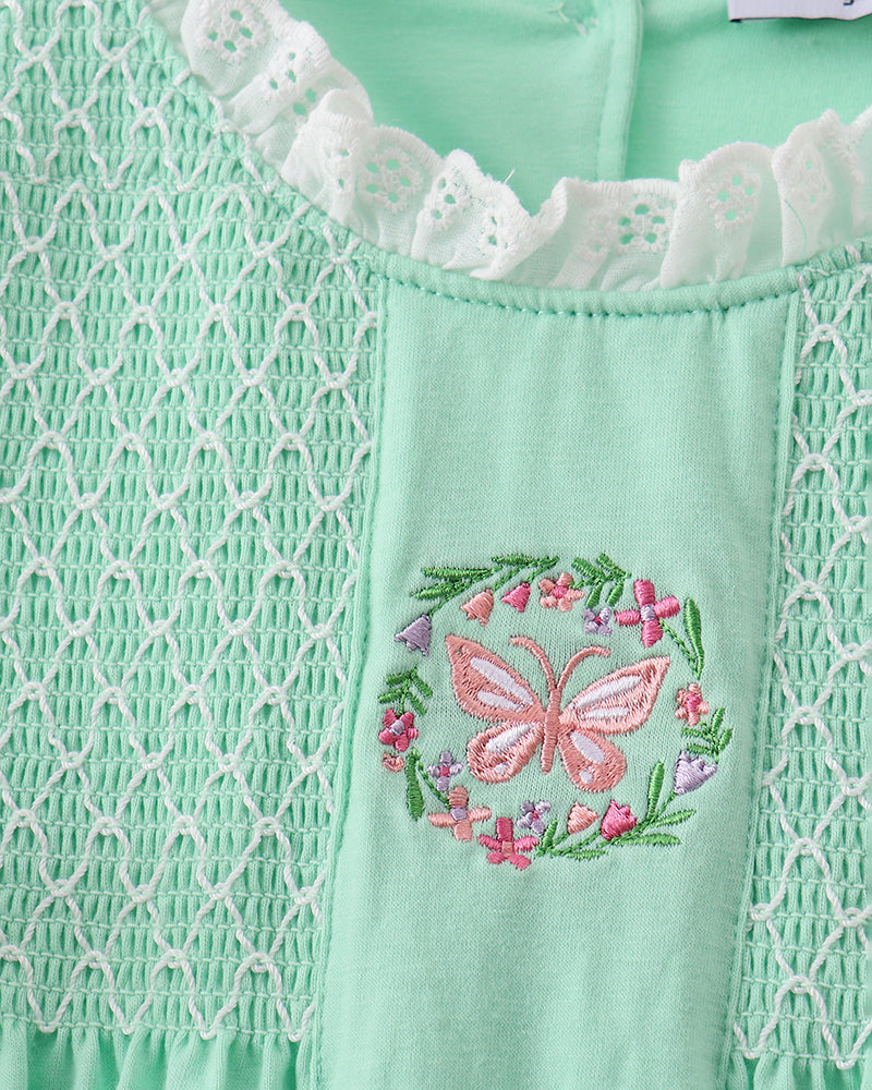 Mint green dress with butterfly and floral embroidery detail