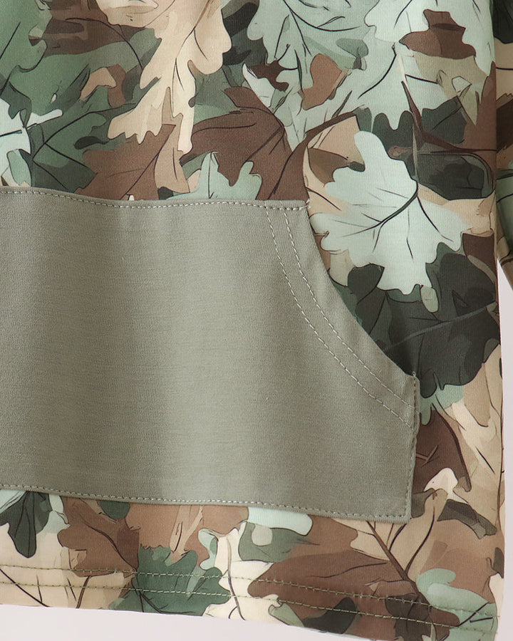 Camouflage hoodie with pale pocket panel and leaf-pattern body