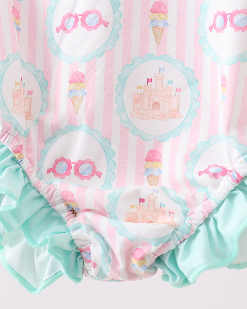 Rashguard with ice cream cone and castle pattern on pink and white striped background