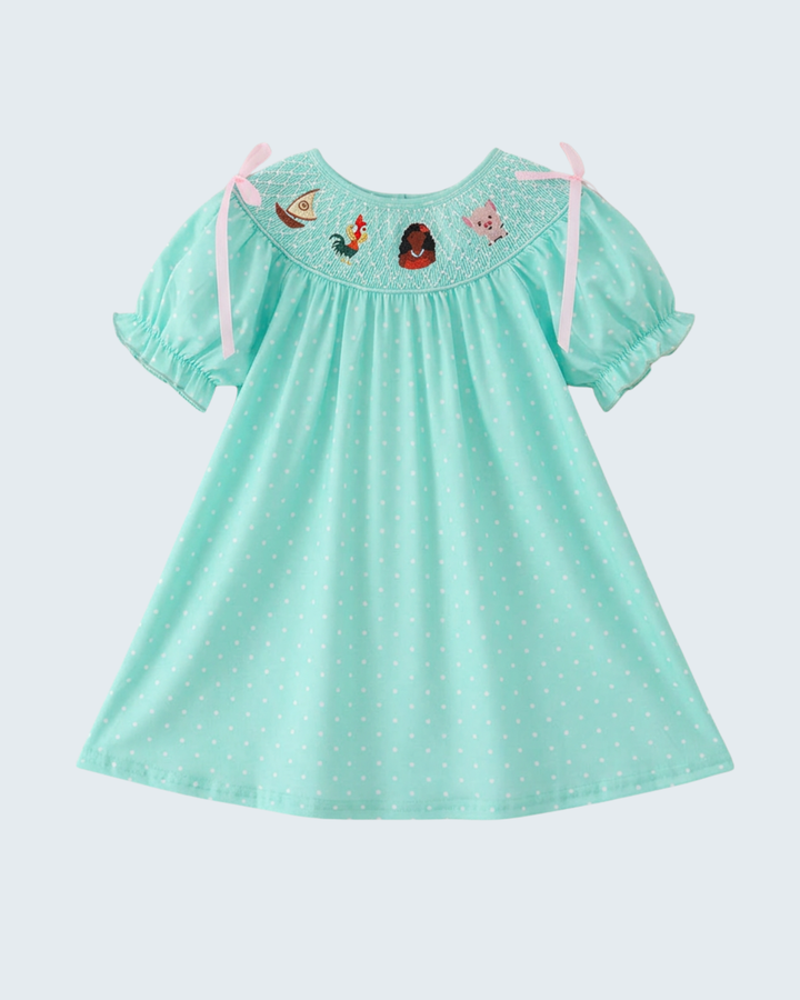 Turquoise smocked dress with dotted skirt, short puff sleeves, character yoke and bows