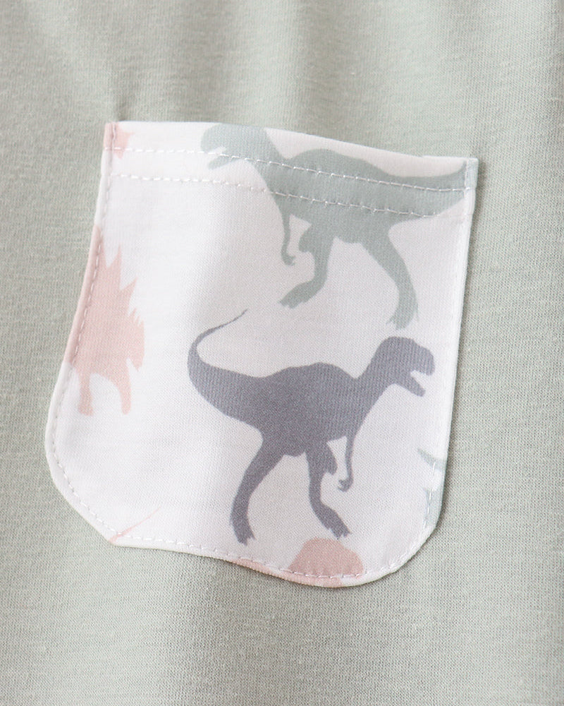 Green shirt with dinosaur print of pocket