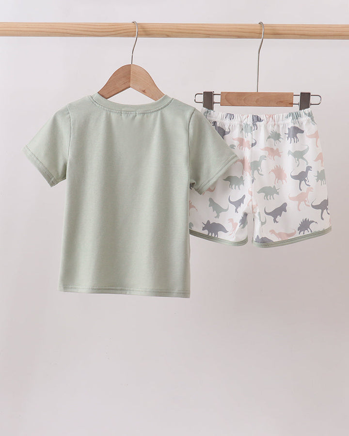 Green Dinosaur Shorts Set on wooden hanger
