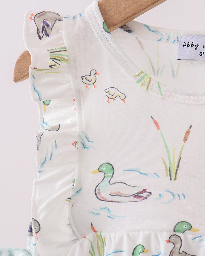 Baby romper with duck pattern on a white background