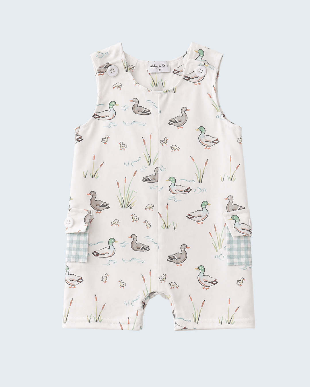 Baby romper with duck pattern on a light blue background