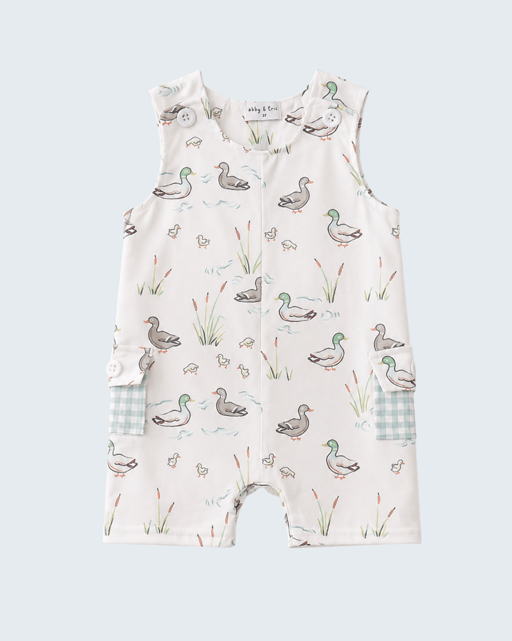 Baby romper with duck pattern on a light blue background