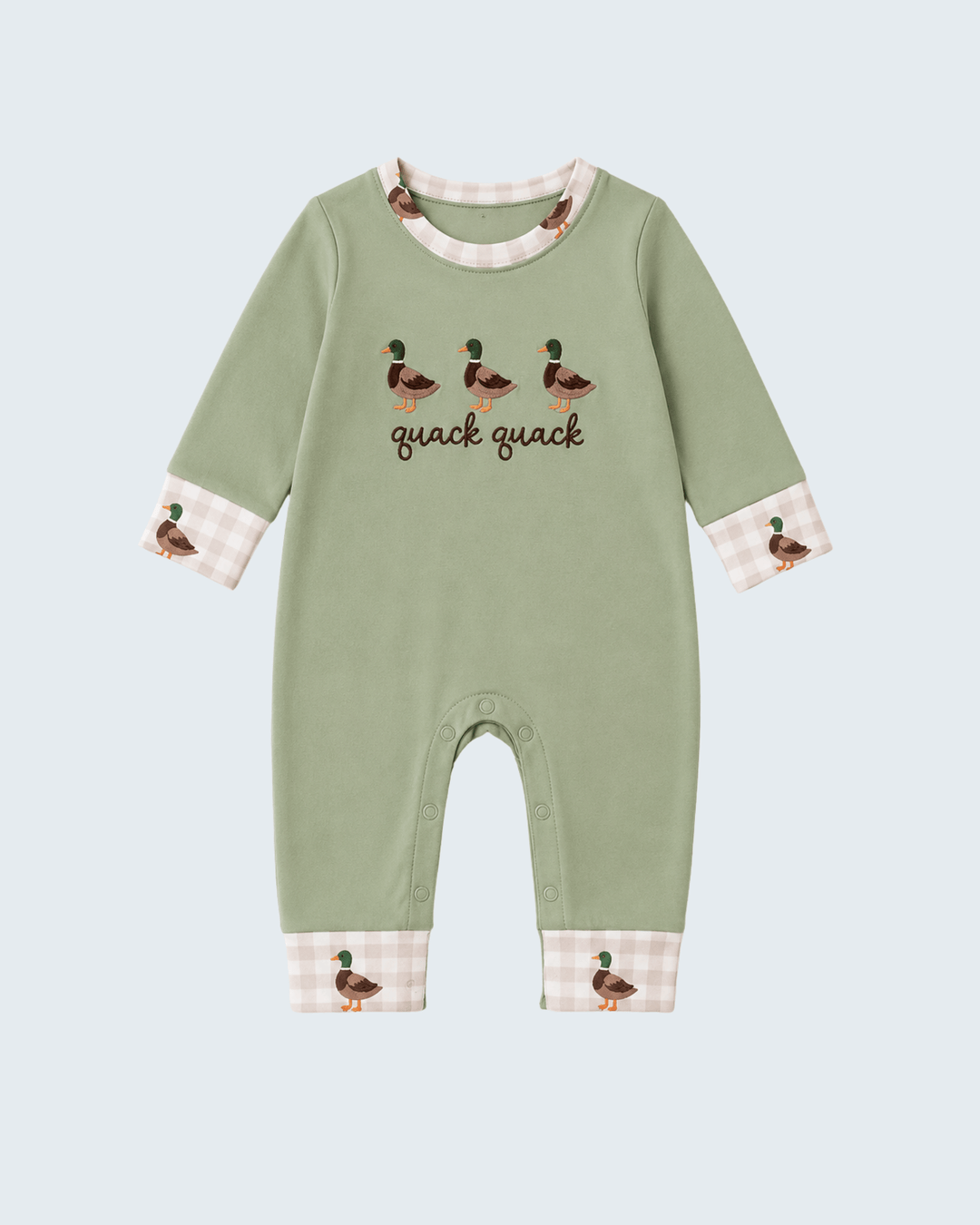 A baby long-sleeve footless romper in sage green, featuring embroidered ducks and the text &