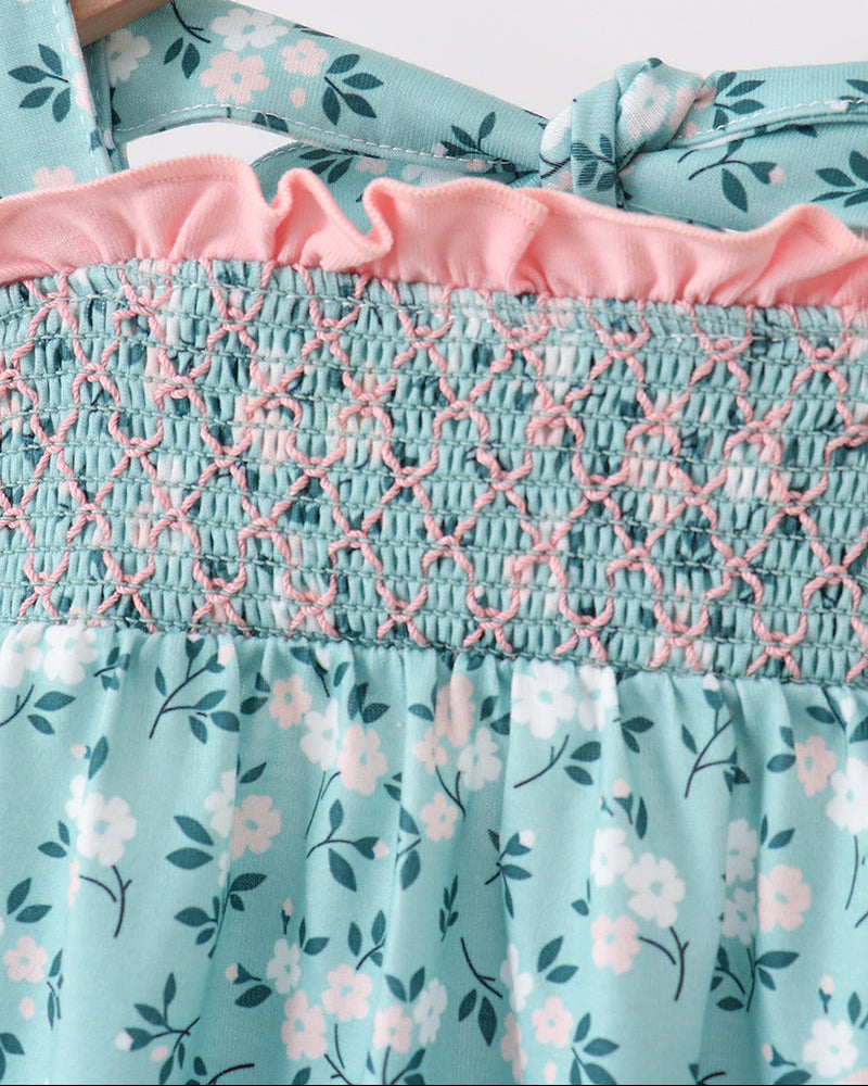 Smocked bodice detail on turquoise floral ruffle bubble romper
