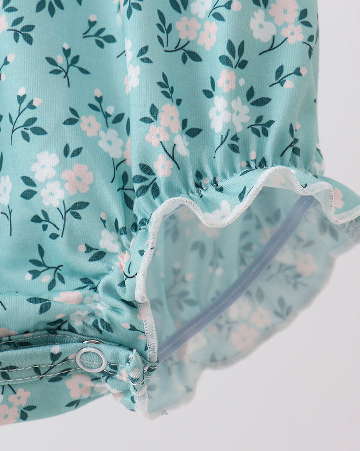 Turquoise floral bubble romper with scalloped ruffle leg openings and elastic waist