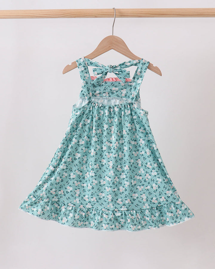 Green floral smocked ruffle dress with bow straps and gathered skirt