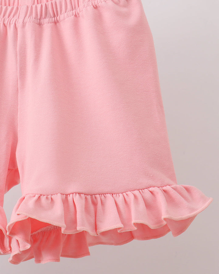 Pink shorts with tiered ruffle hem and elastic waist