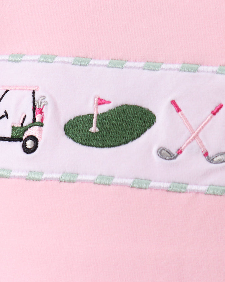 Pink fabric with golf embroidery