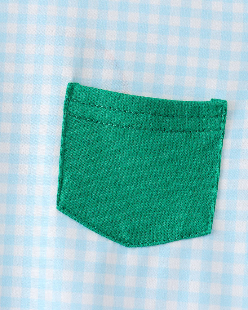 Green pocket on a blue and white checkered fabric