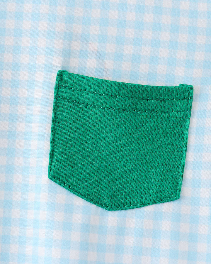 Green pocket on a blue and white checkered fabric