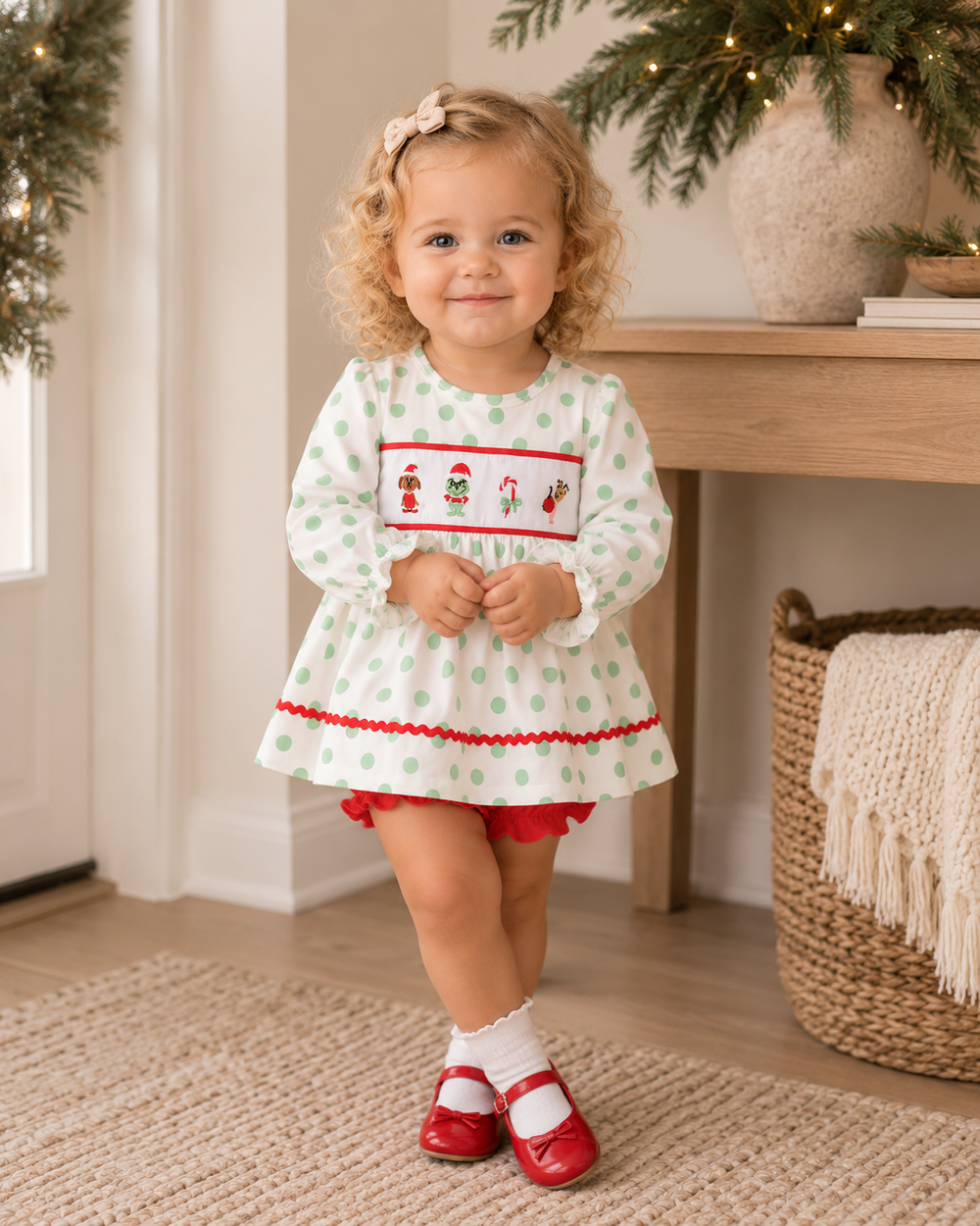 Toddler outfit: green polka-dot ruffle dress with embroidered holiday motifs and red bloomer shorts