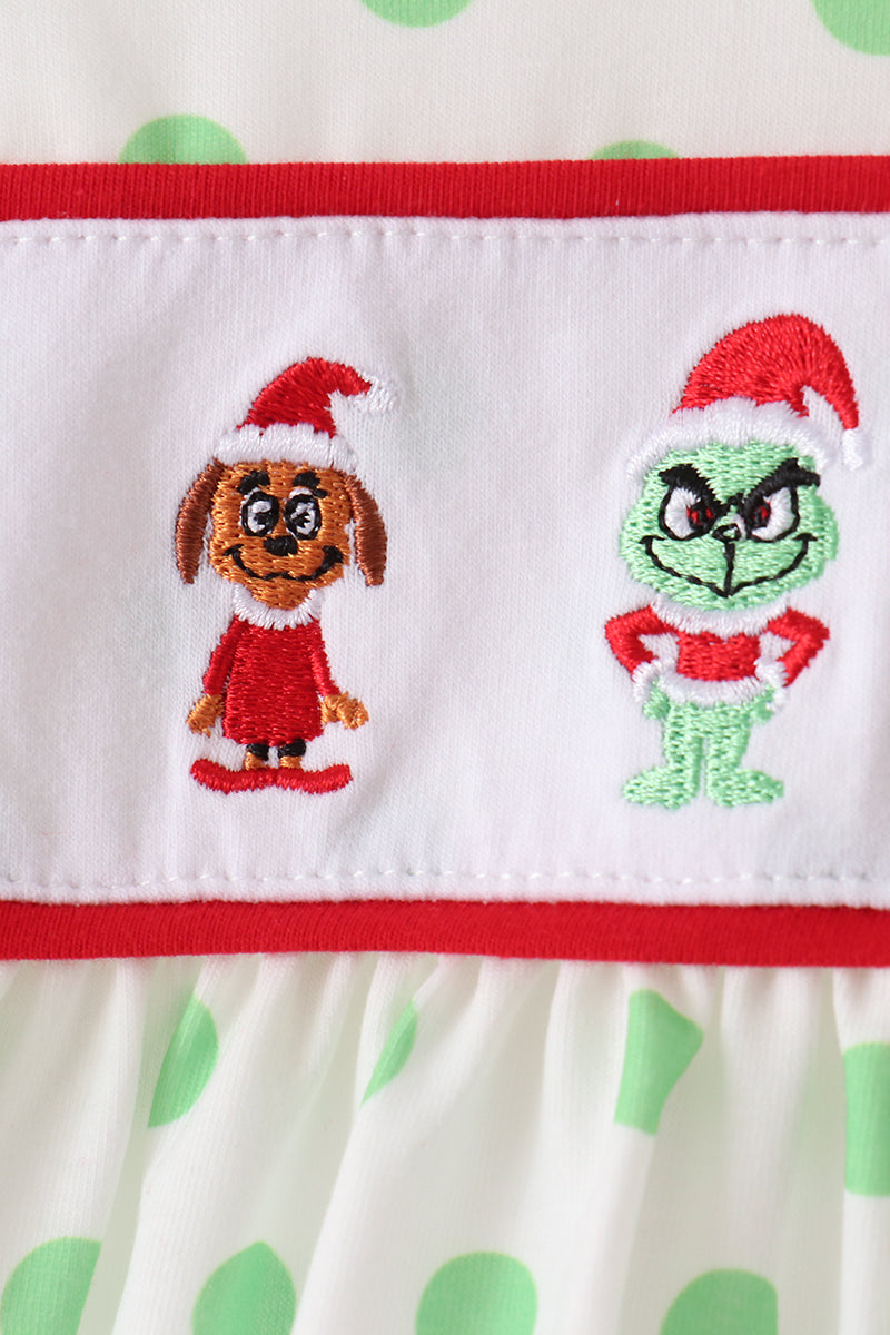 White dress hem with red edge and two embroidered character patches