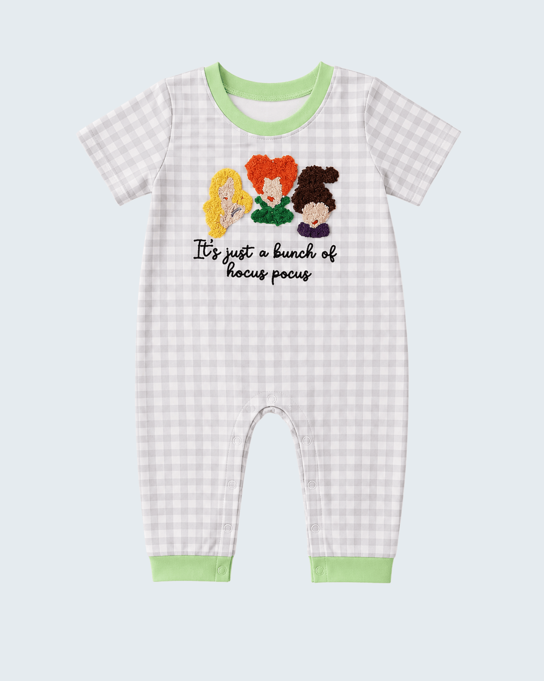 Light blue gingham romper with green trim and 'hocus pocus' applique