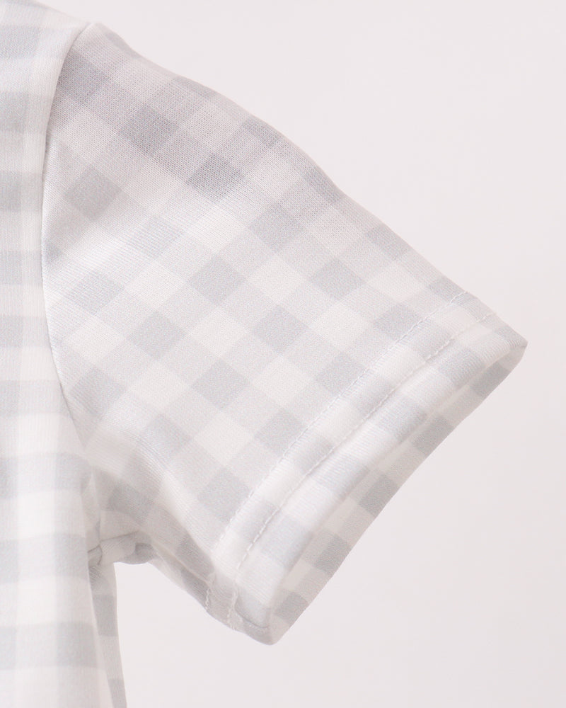 Light blue gingham romper with green cuff and short sleeve