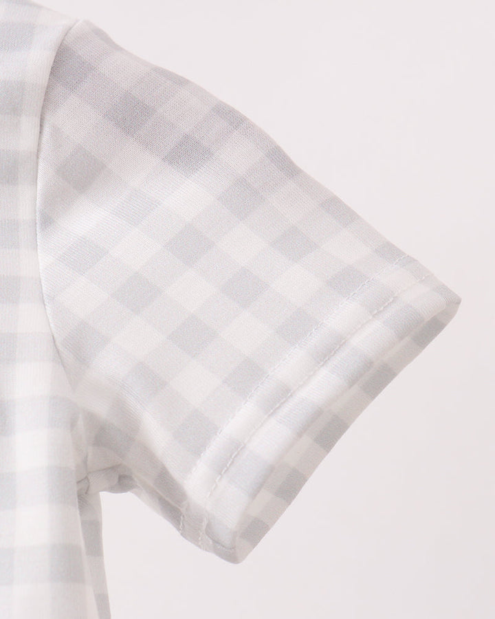 Light blue gingham romper with green cuff and short sleeve