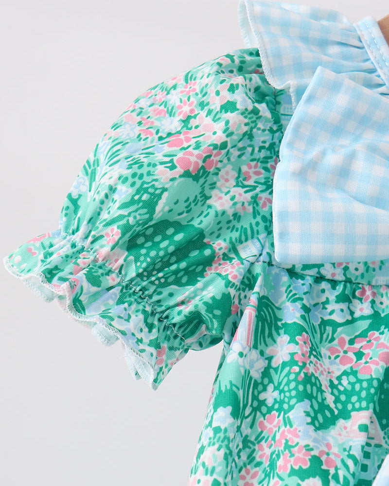 Green floral dress with a white background