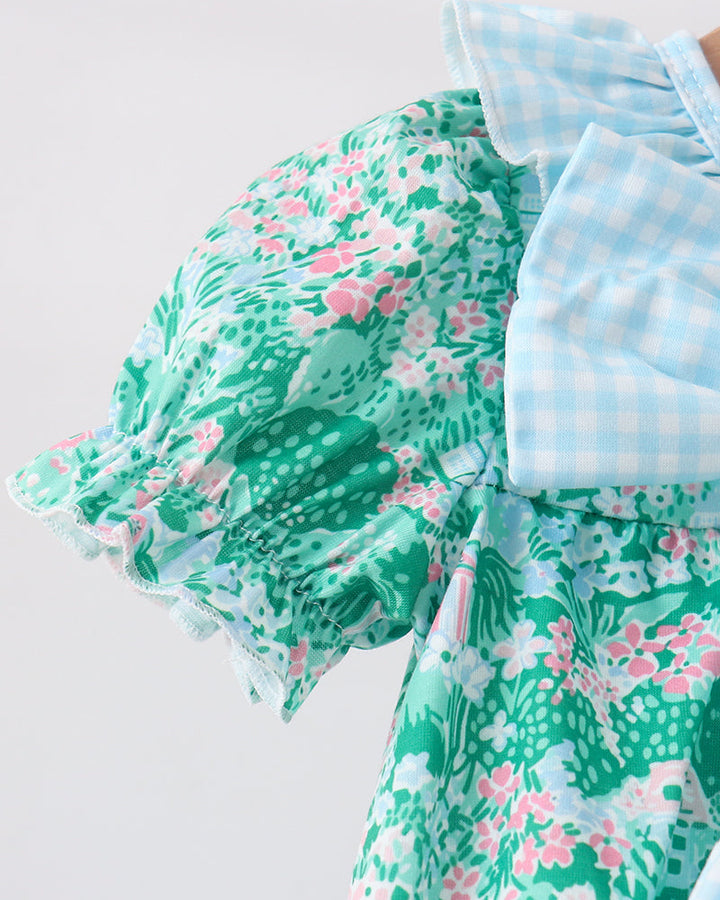 Green floral dress with a white background