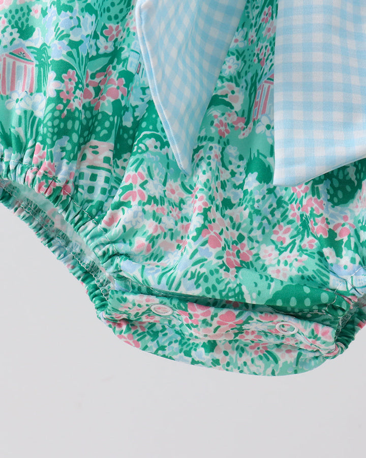 Floral fabric with green and pink pattern on a white background
