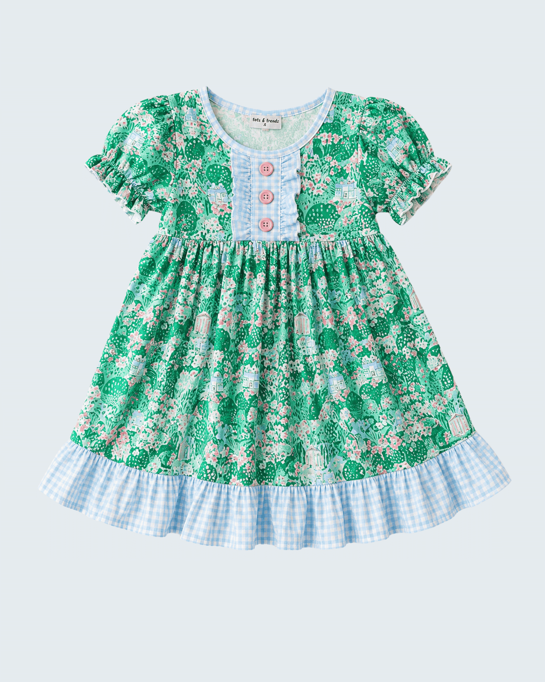 Green floral dress with checkered bottom on a light blue background