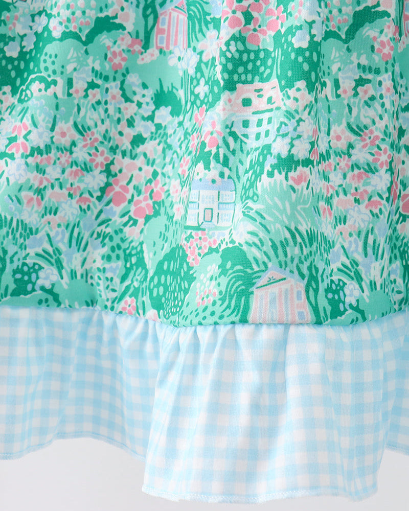Floral patterned fabric with a checkered bottom border on a white background