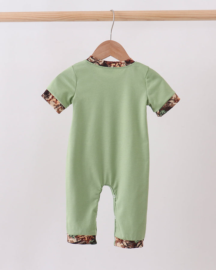 Green Hunting Print Romper on wooden hanger