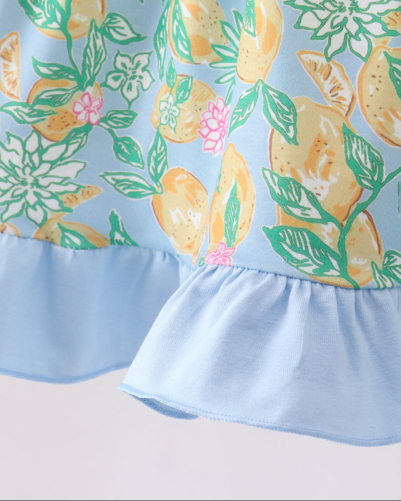 Close up of dress with lemon print and ruffles