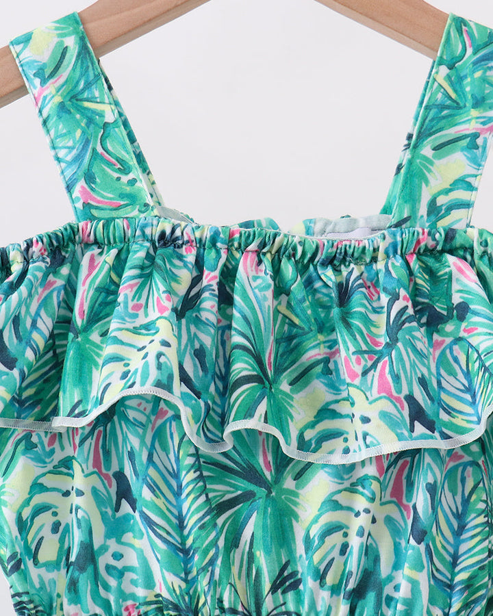Green Lily floral jumpsuit close-up: off-shoulder ruffle neckline, elastic waist, teal print