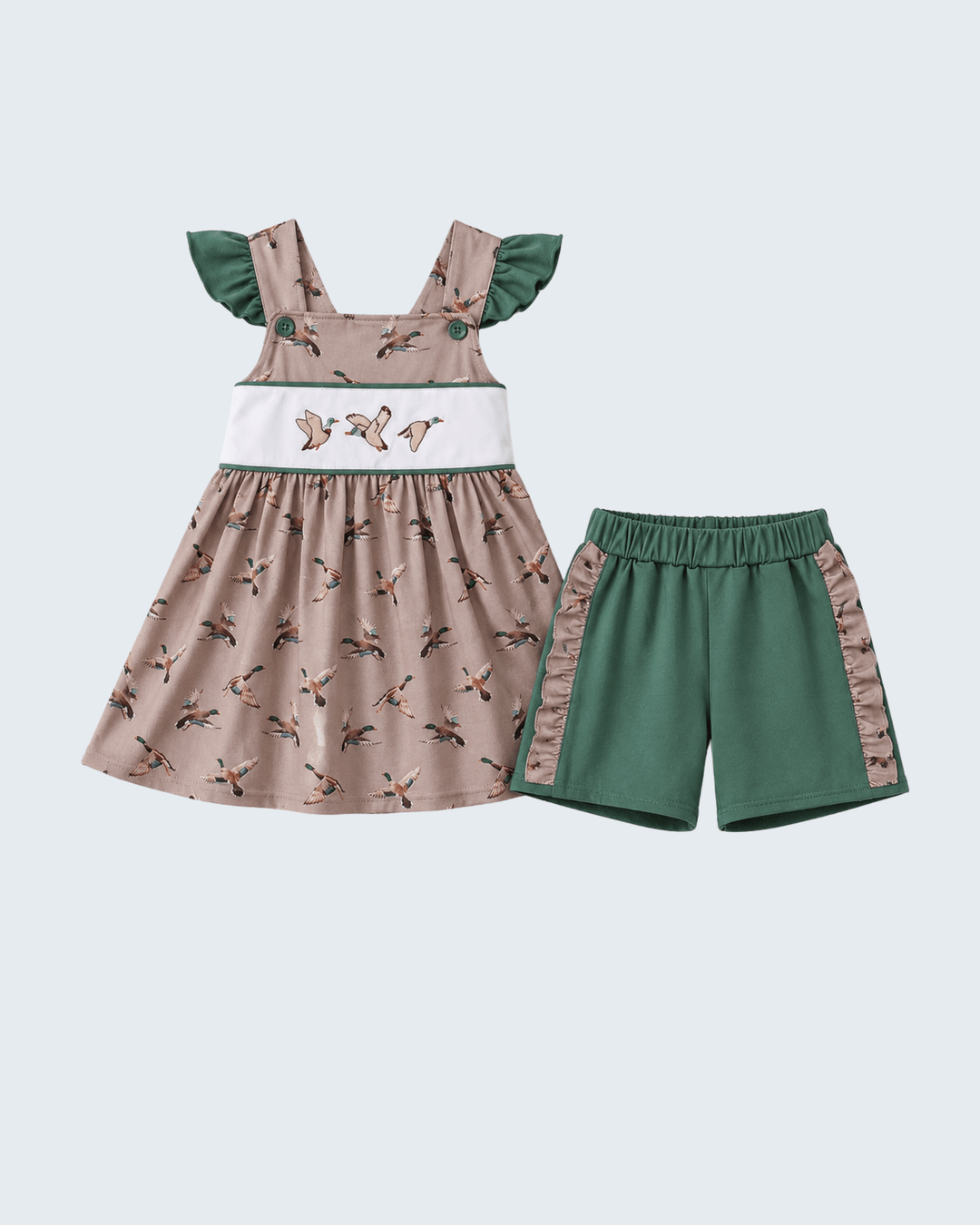 Children's dress and shorts set with bird pattern on a light gray background