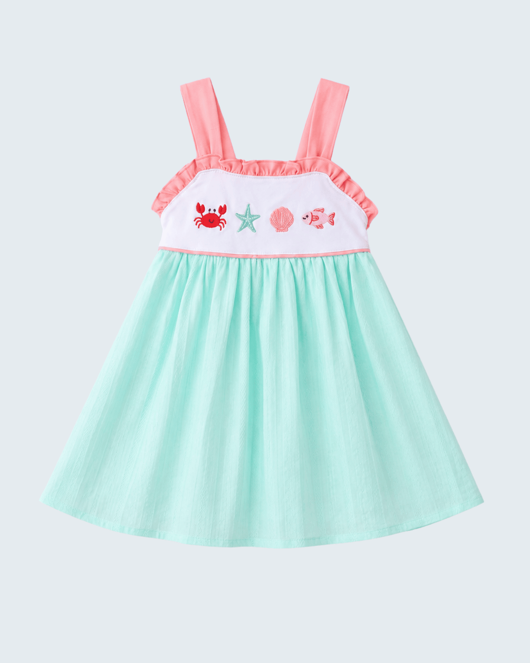 Children's dress with pink straps and sea-themed embroidery on a light gray background