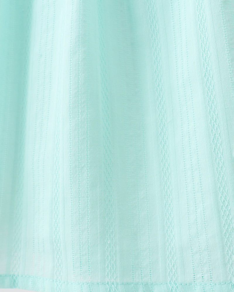 Close-up of a textured light blue fabric