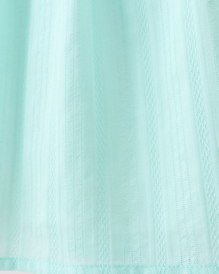 Close-up of a textured light blue fabric
