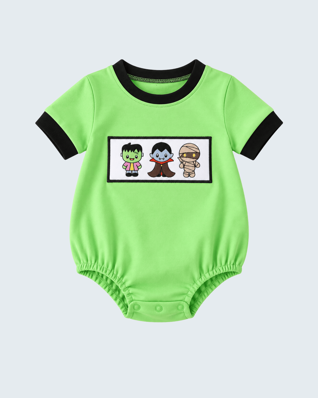 Green short-sleeve bubble romper with black trim, embroidered patch and snap buttons