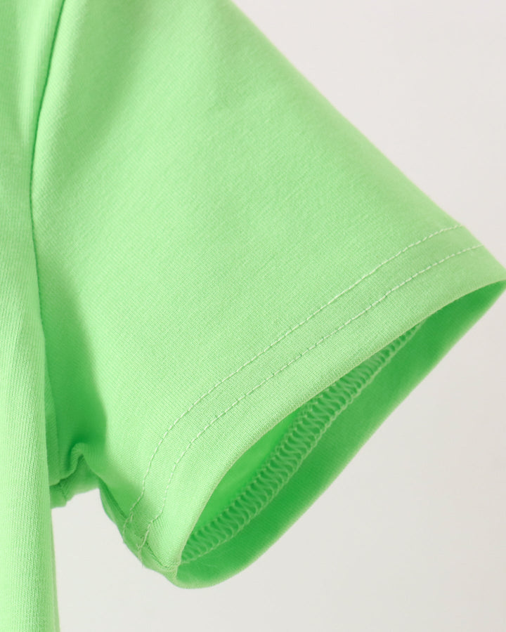 Close-up of a bright lime green short-sleeve t-shirt showing the sleeve cuff with neat stitching, set against a plain light background.
