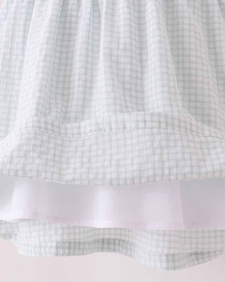 Flowy light blue plaid skirt with layered white ruffle hem