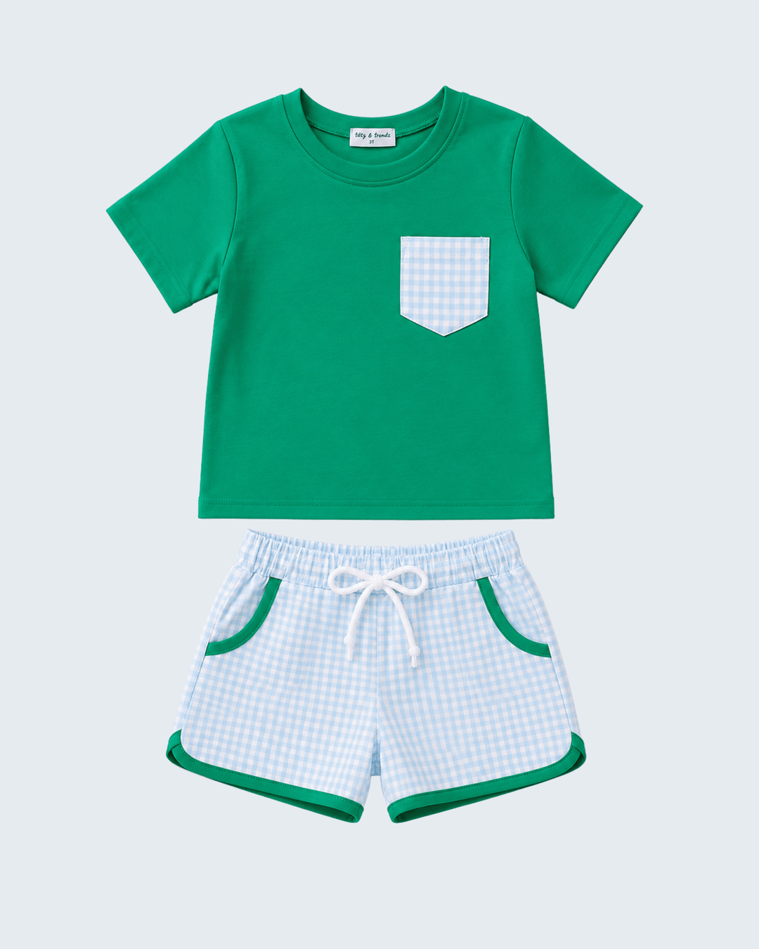 Green t-shirt with a pocket and checkered shorts on a light blue background