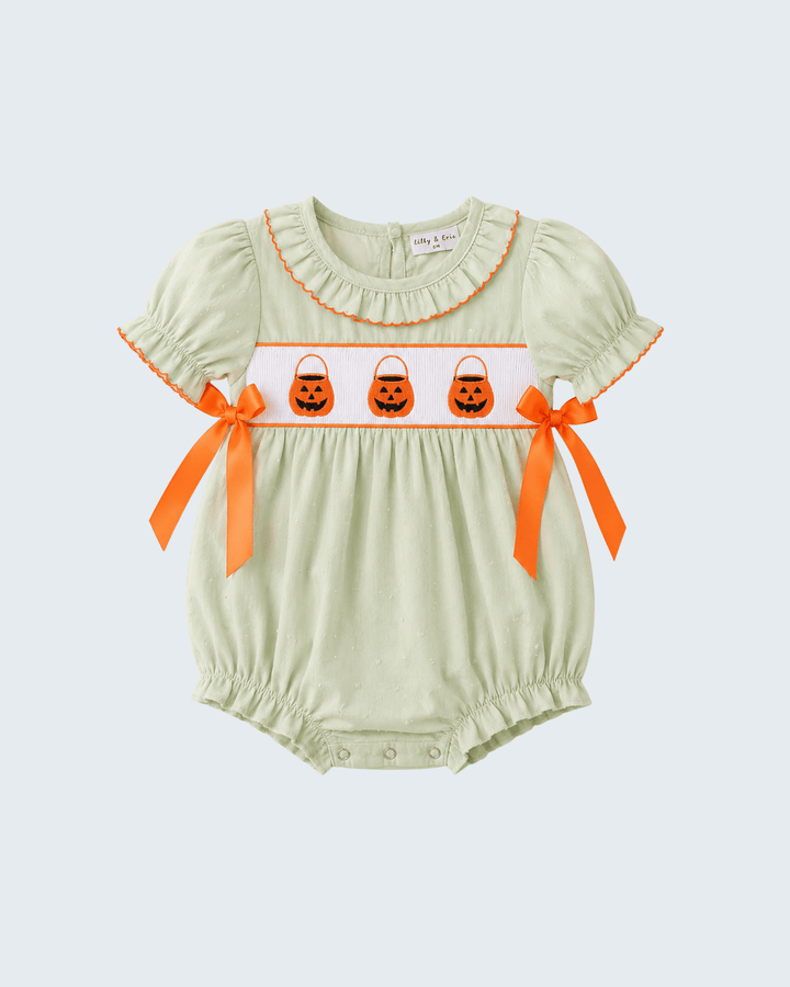 A baby short-sleeve romper in pale sage green with orange ruffle trim, featuring a white chest band with three orange jack-o&
