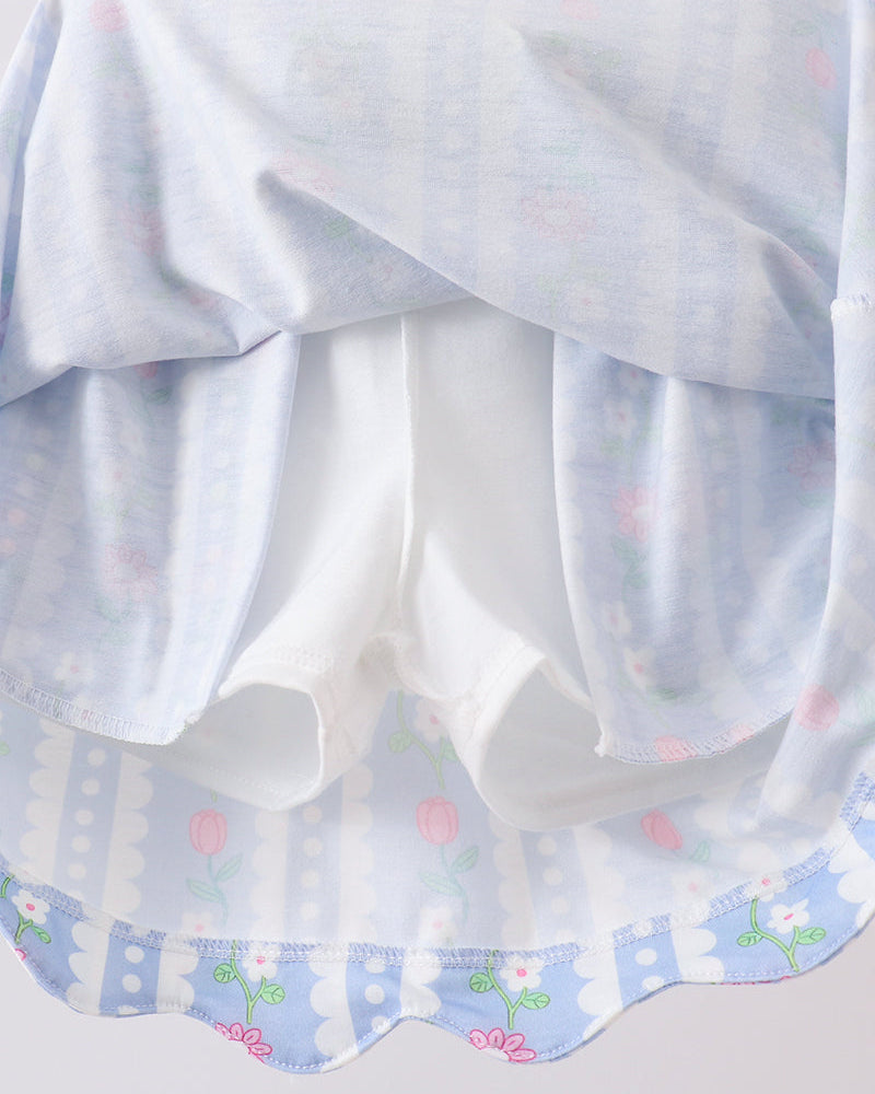 Sheer white fabric with floral patterns on a light gray background