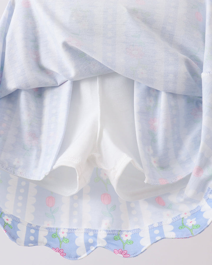 Sheer white fabric with floral patterns on a light gray background