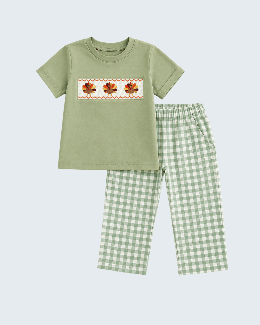 Green short-sleeve top with orange flower embroidery and green plaid pants