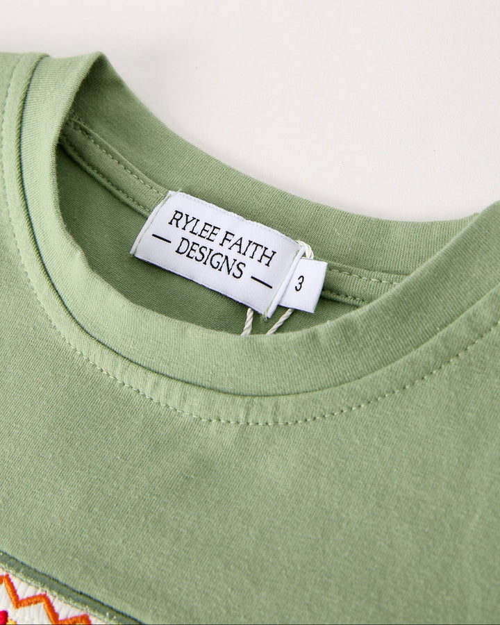 Green short-sleeve shirt with crew neck and inner brand label